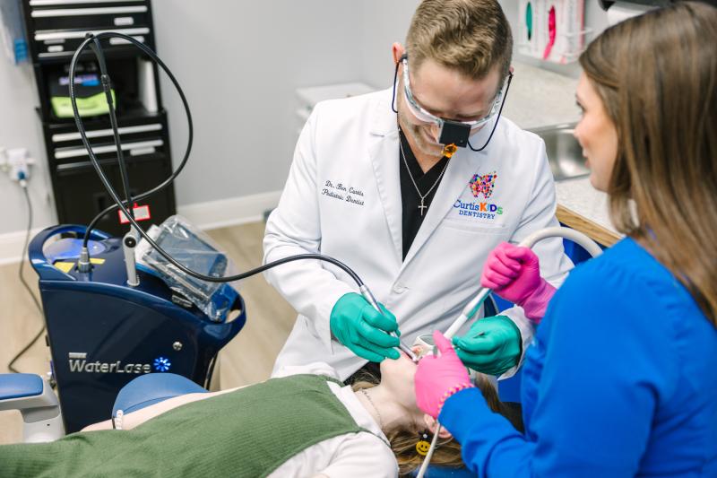 Child undergoes pediatric laser dentistry in Canton, TX.