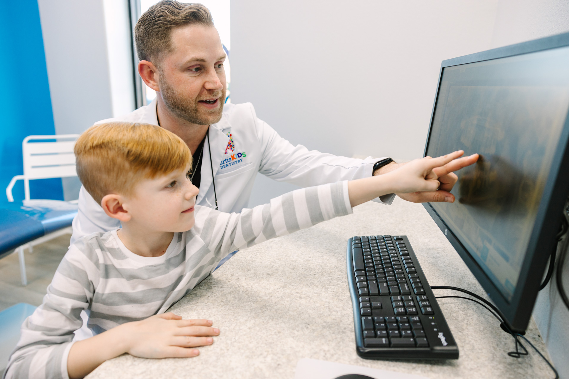 Dr. Curtis showing a child their X-ray