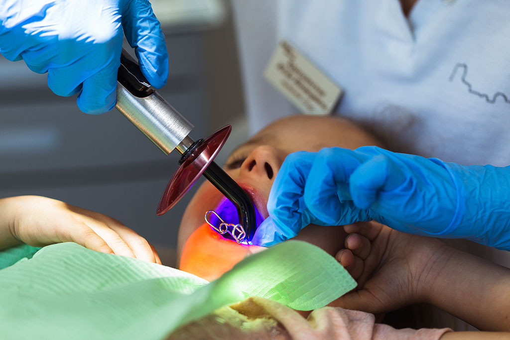 Dr. Curtis performing laser dentistry