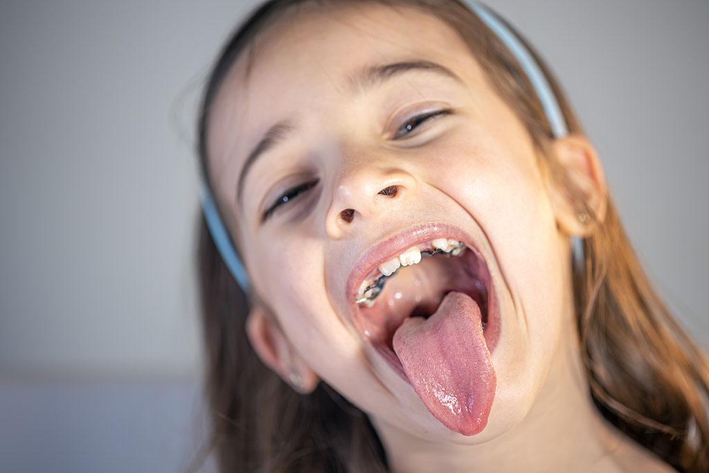 Child sticking out their tongue